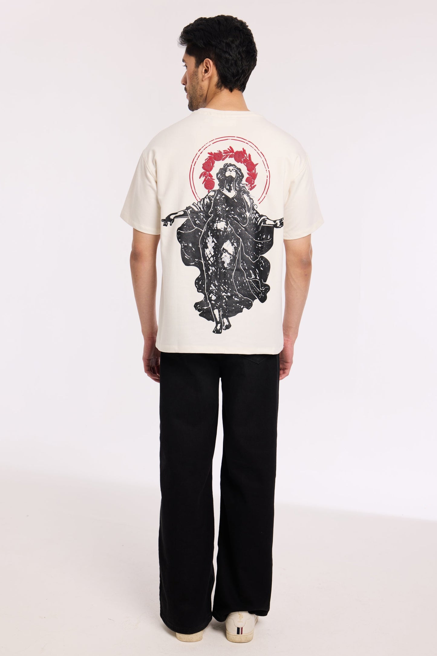 Back view of model wearing Revrce Divine Ascent T Shirt by Revrce, oversized streetwear t-shirt