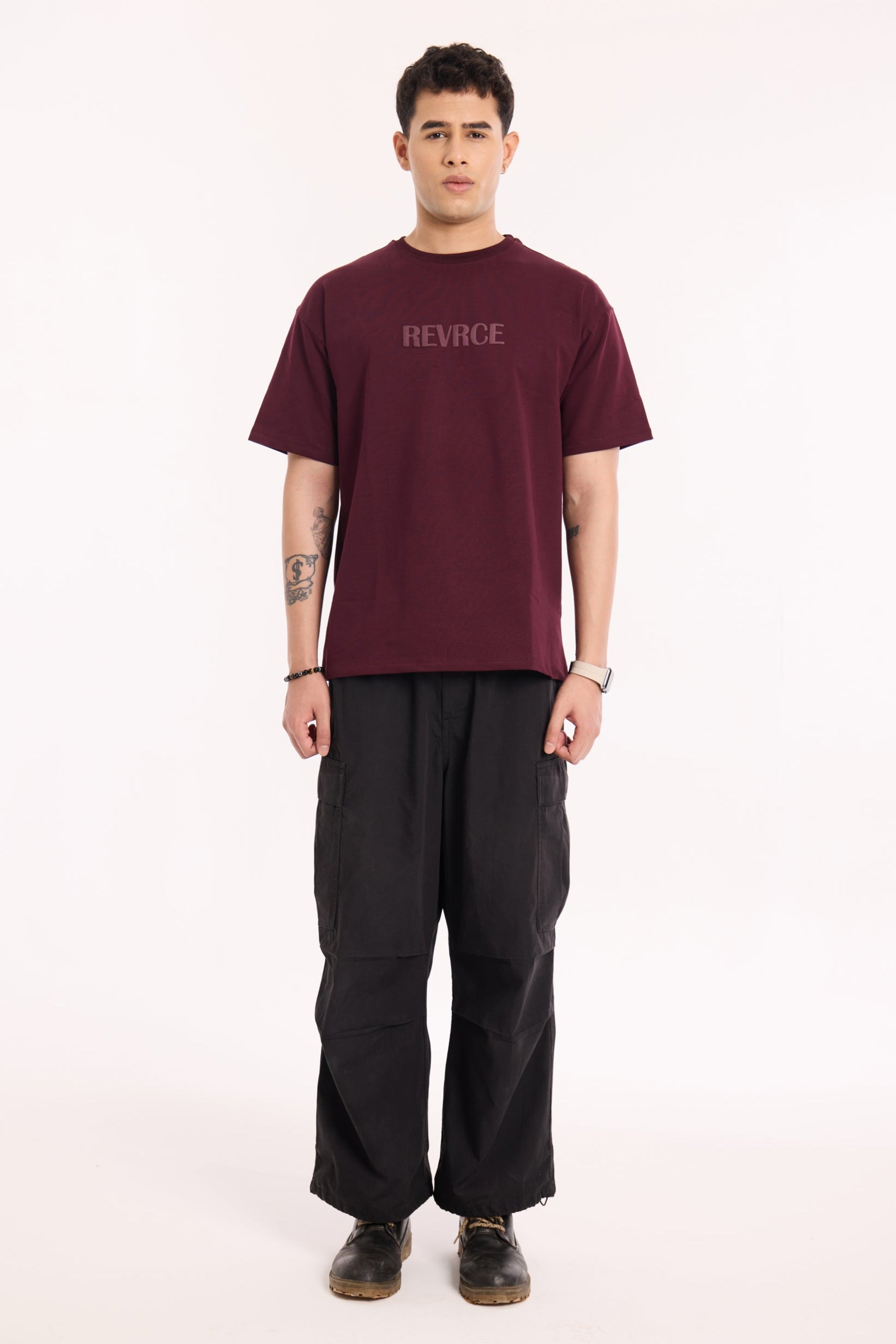 Back view of model wearing Bloodline T Shirt by Revrce, oversized streetwear t-shirt