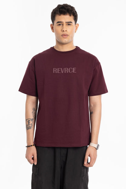 Model wearing Bloodline T Shirt by Revrce, oversized fit streetwear T-shirt with front graphic