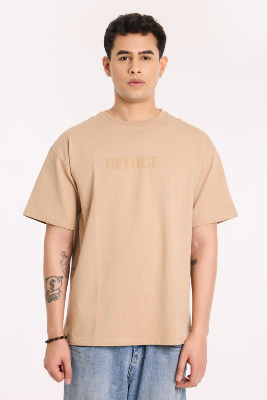 Model wearing Sandy Silence T Shirt by Revrce, oversized fit streetwear T-shirt with front graphic