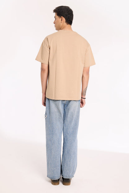 Close-up of Sandy Silence T Shirt by Revrce showing puff print or fabric texture