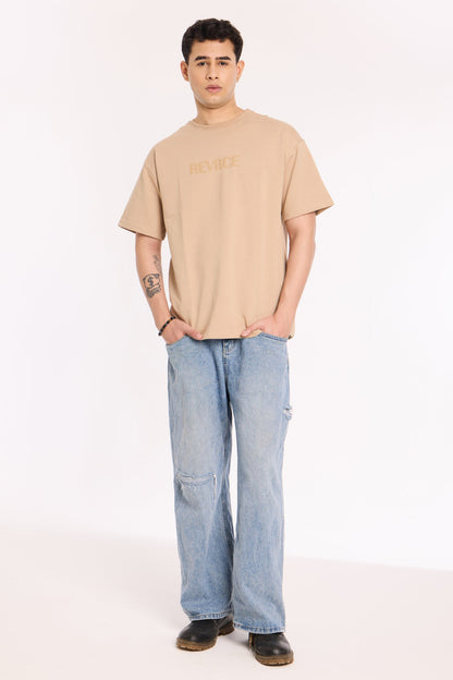 Back view of model wearing Sandy Silence T Shirt by Revrce, oversized streetwear t-shirt