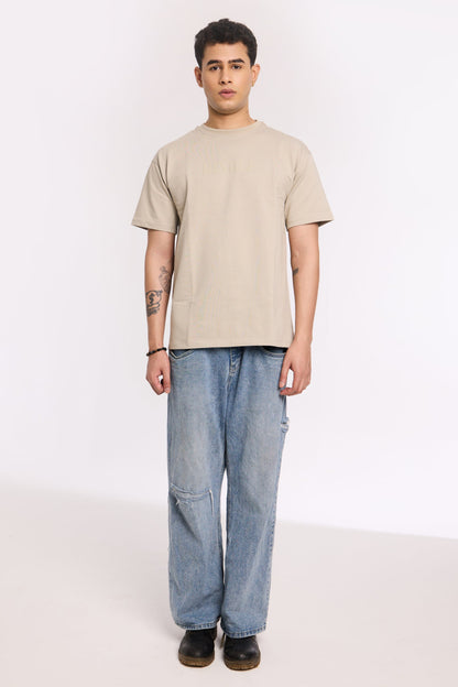 Back view of model wearing Concrete Soul T Shirt by Revrce, oversized streetwear t-shirt