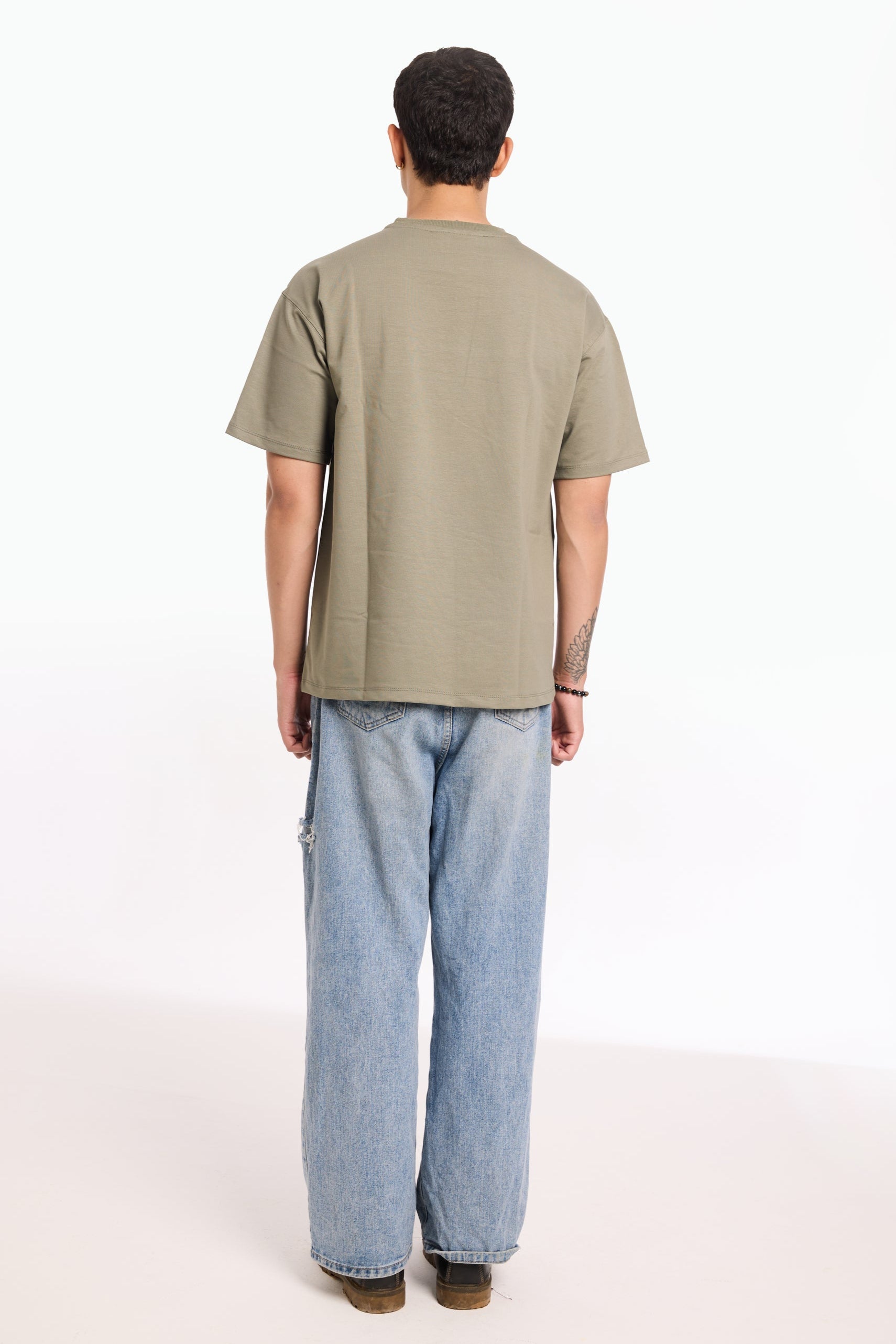 Flat lay of Cement by Revrce, oversized streetwear t-shirt in detail