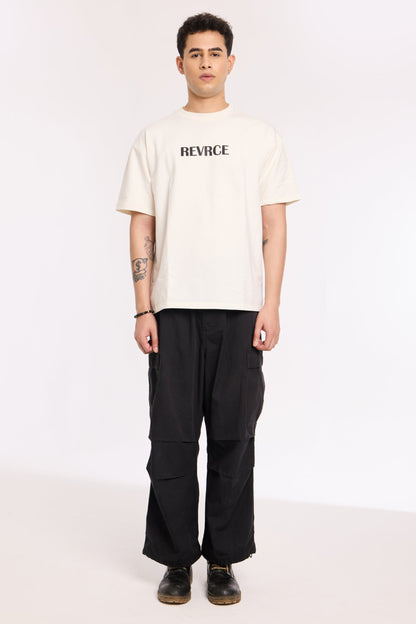 Back view of model wearing Off White Noise T Shirt by Revrce, oversized streetwear t-shirt
