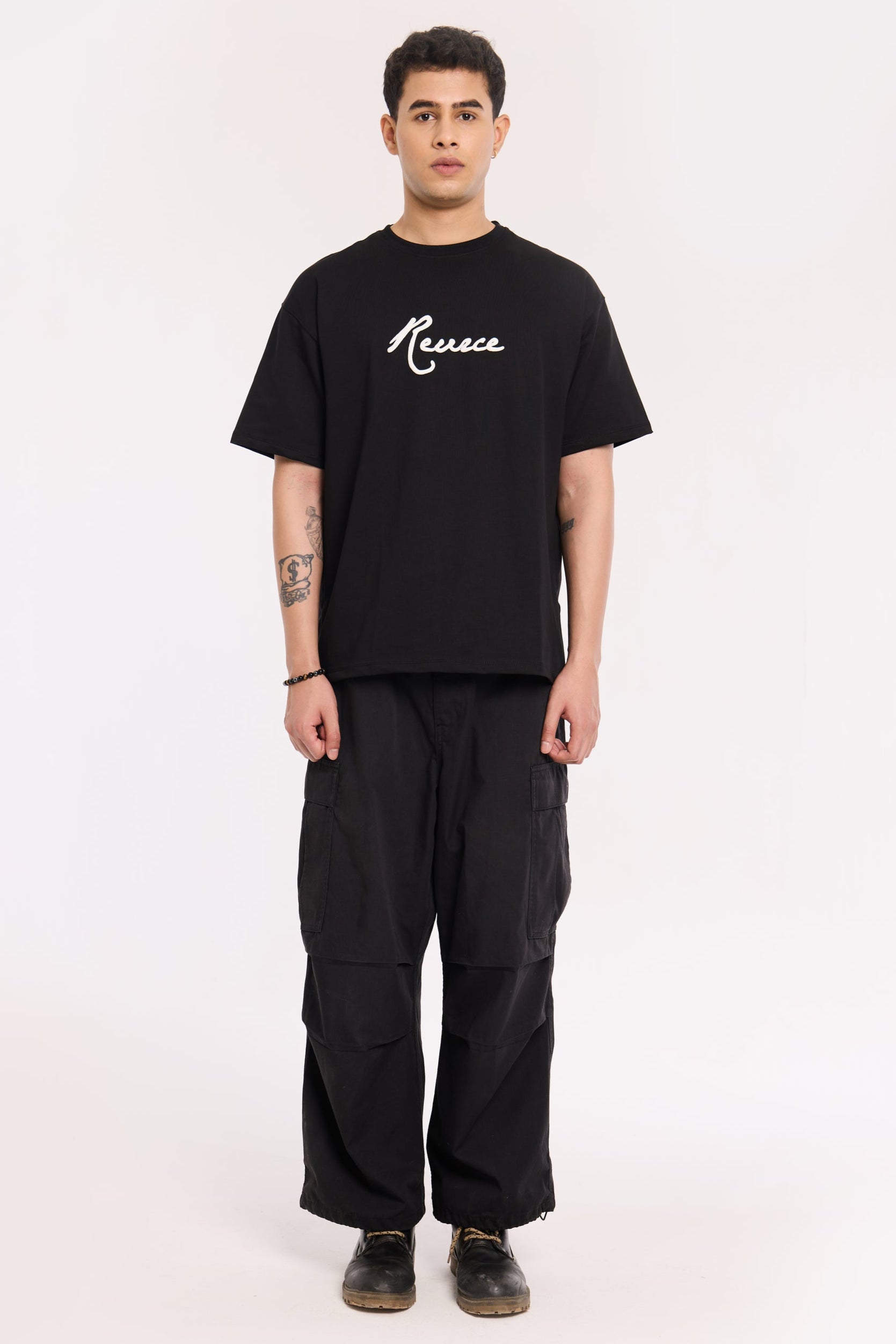 Model wearing Pretty Good T Shirt by Revrce, oversized fit streetwear T-shirt with front graphic