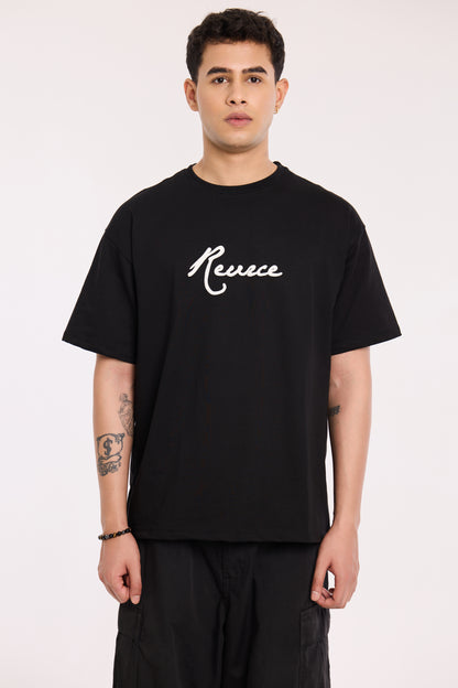 Back view of model wearing Pretty Good T Shirt by Revrce, oversized streetwear t-shirt