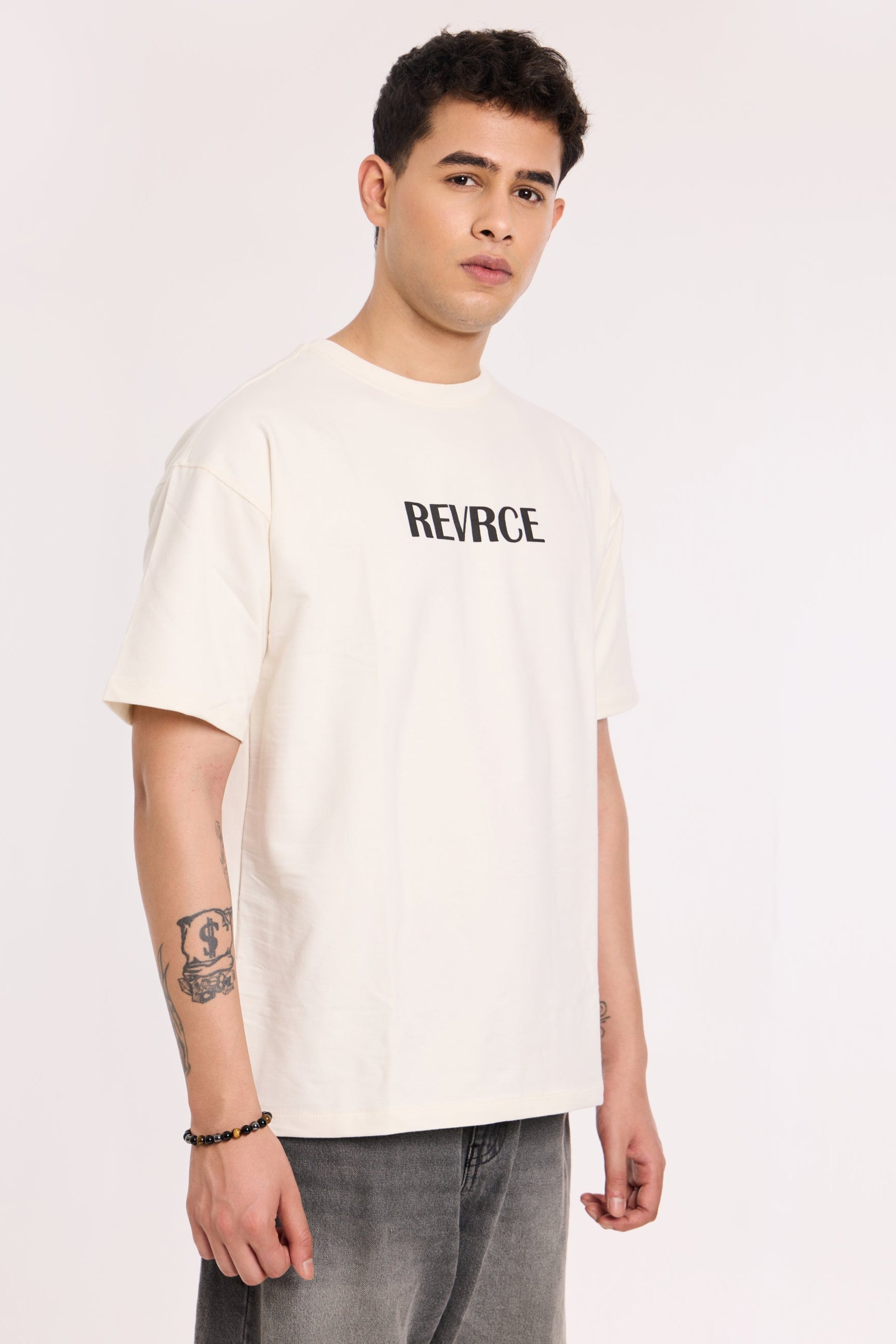 Model wearing Revrce Divine Ascent T Shirt by Revrce, oversized fit streetwear T-shirt with front graphic