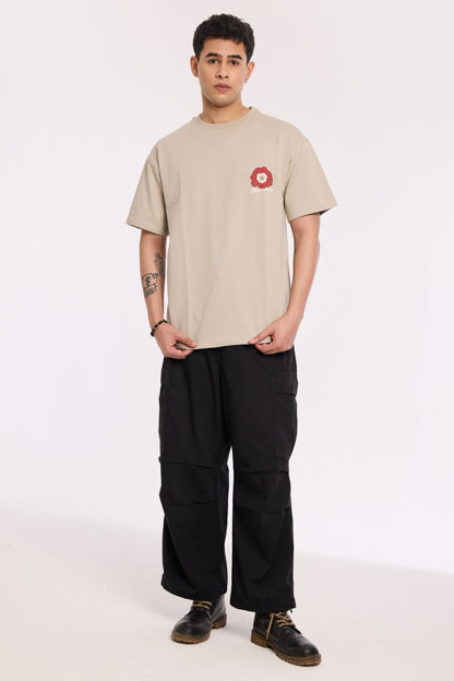 Back view of model wearing Concrete Beyond Time T Shirt by Revrce, oversized streetwear t-shirt