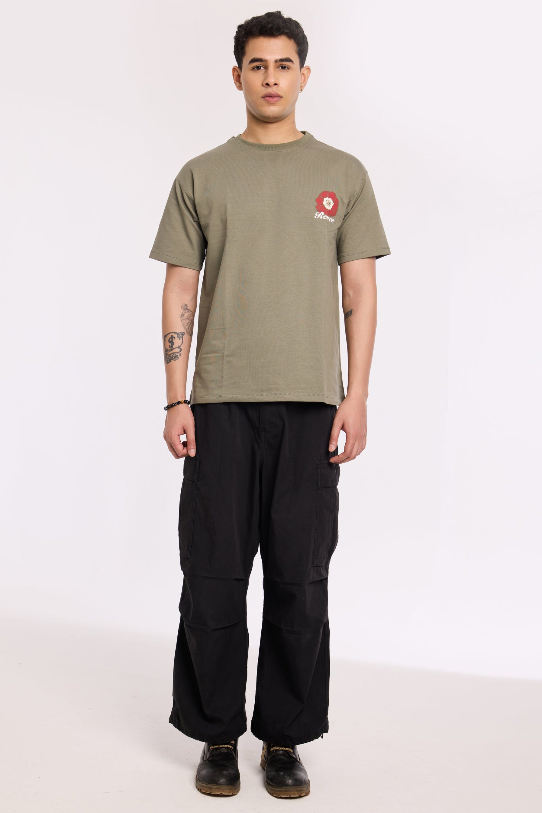 Model wearing Olive Beyond Time T Shirt by Revrce, oversized fit streetwear T-shirt with front graphic