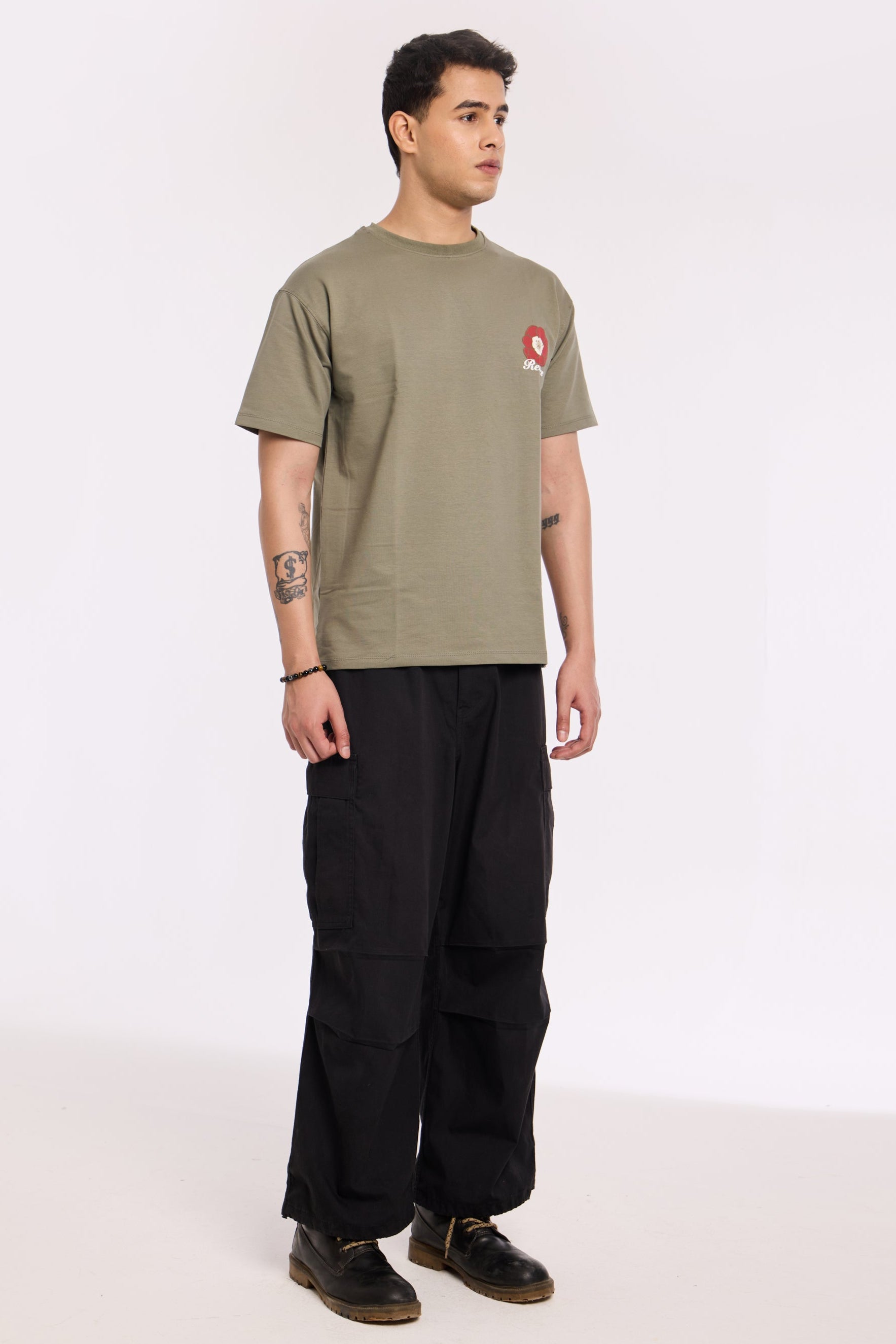Back view of model wearing Olive Beyond Time T Shirt by Revrce, oversized streetwear t-shirt
