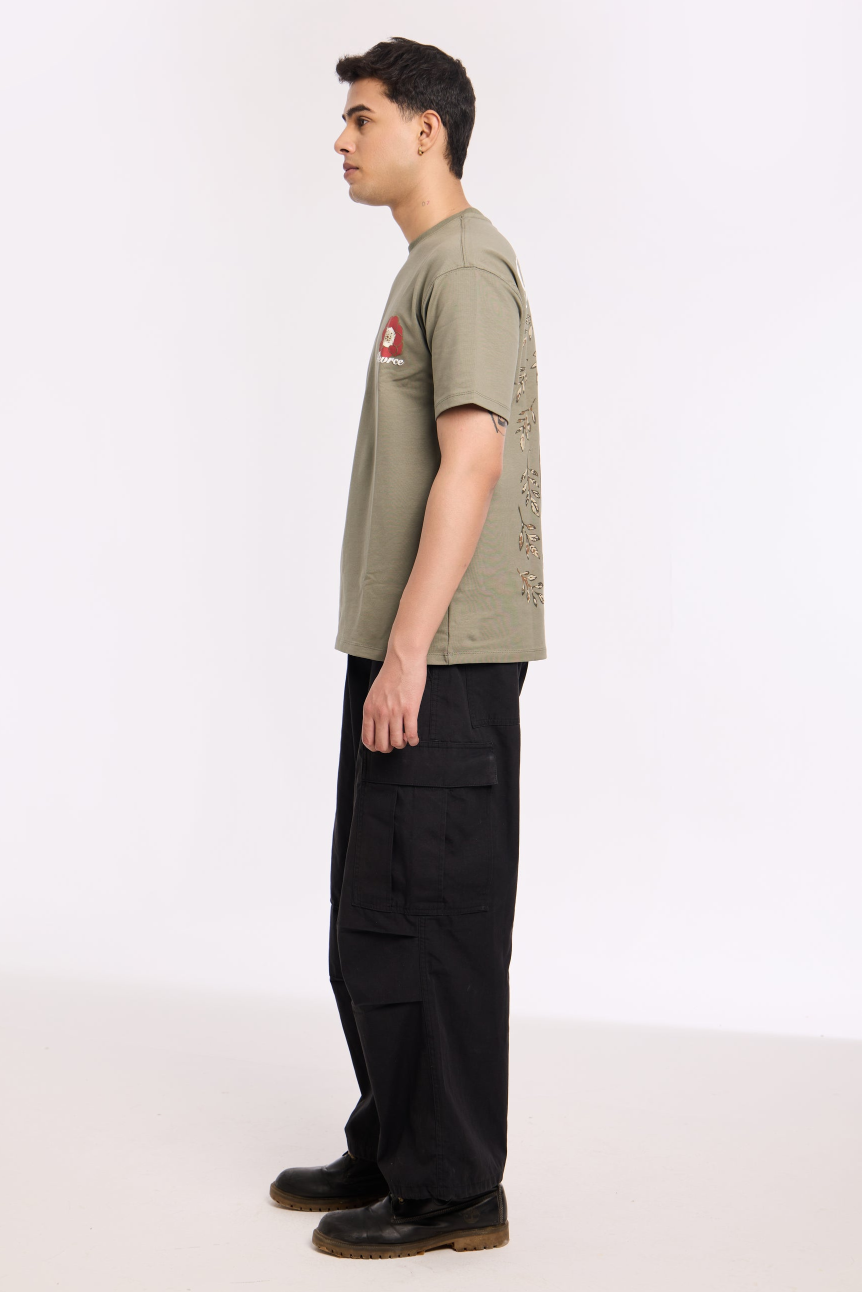Close-up of Olive Beyond Time T Shirt by Revrce showing puff print or fabric texture