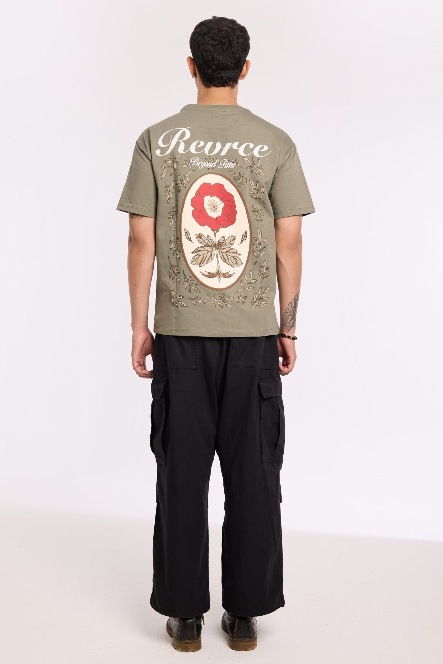 Flat lay of Olive Beyond Time T Shirt by Revrce, oversized streetwear t-shirt in detail