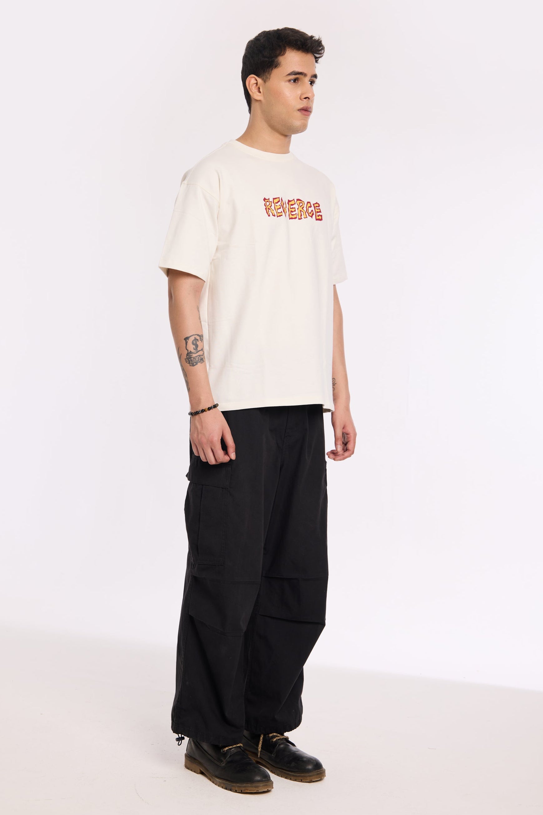 Close-up of Fired Up White T Shirt by Revrce showing puff print or fabric texture