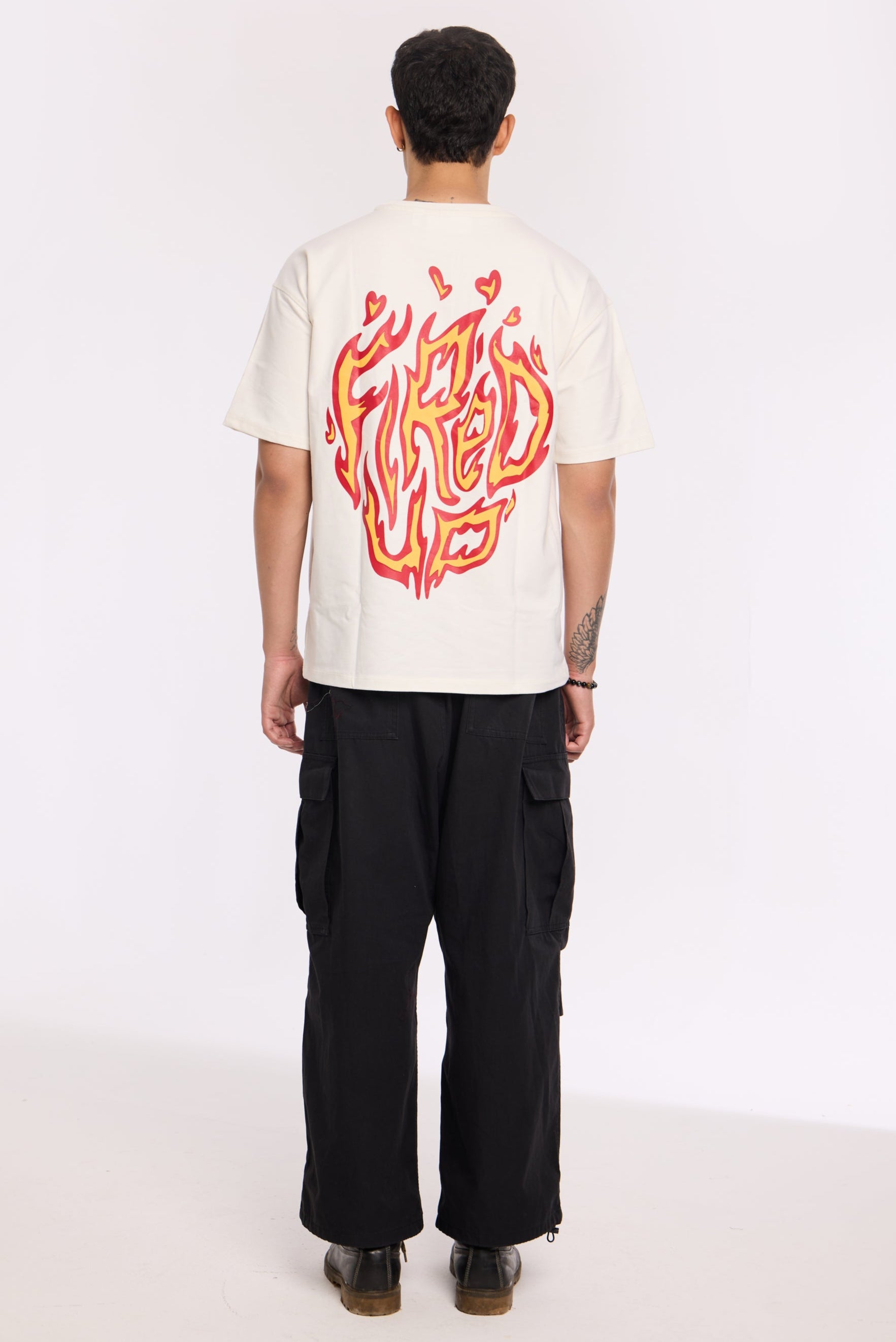 Flat lay of Fired Up White T Shirt by Revrce, oversized streetwear t-shirt in detail
