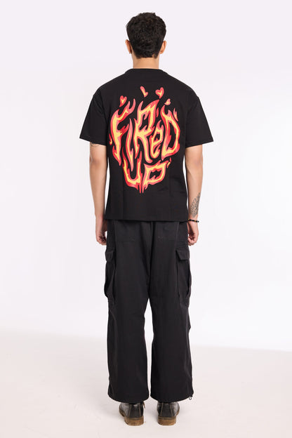 Flat lay of Fired Up Black T Shirt by Revrce, oversized streetwear t-shirt in detail